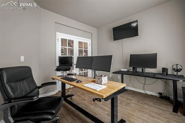 a view of a workspace with furniture