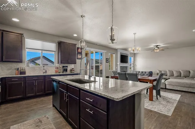 a kitchen with granite countertop a sink and center island