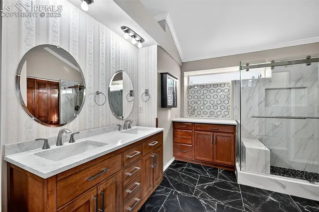 a bathroom with a double vanity sink mirror and bathtub