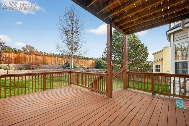 a view of a balcony with wooden floor