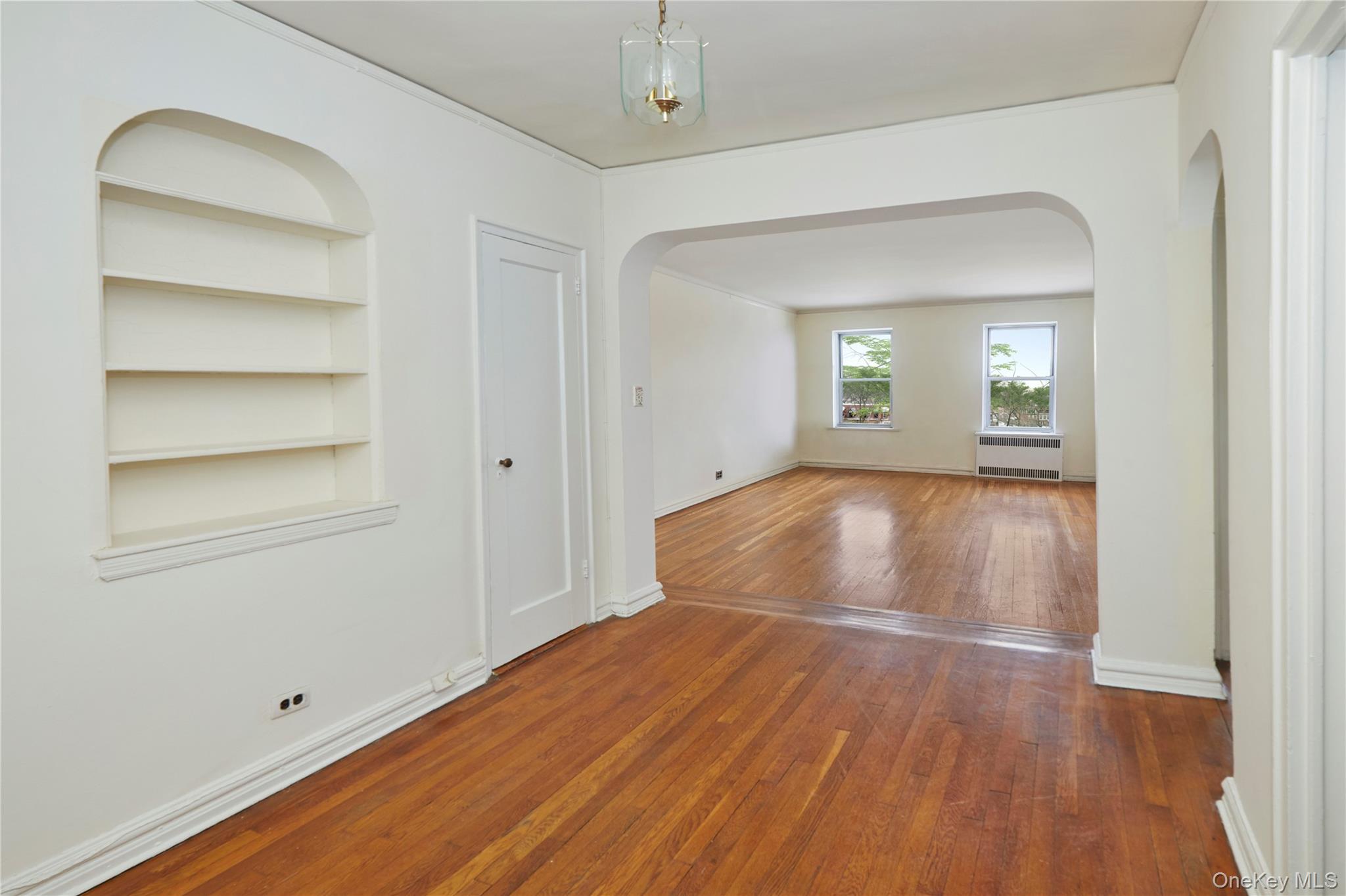 75-40 Austin Street, Unit 5 Queens, NY 11375 - Photo 4 of 12 a view of a room with wooden floor
