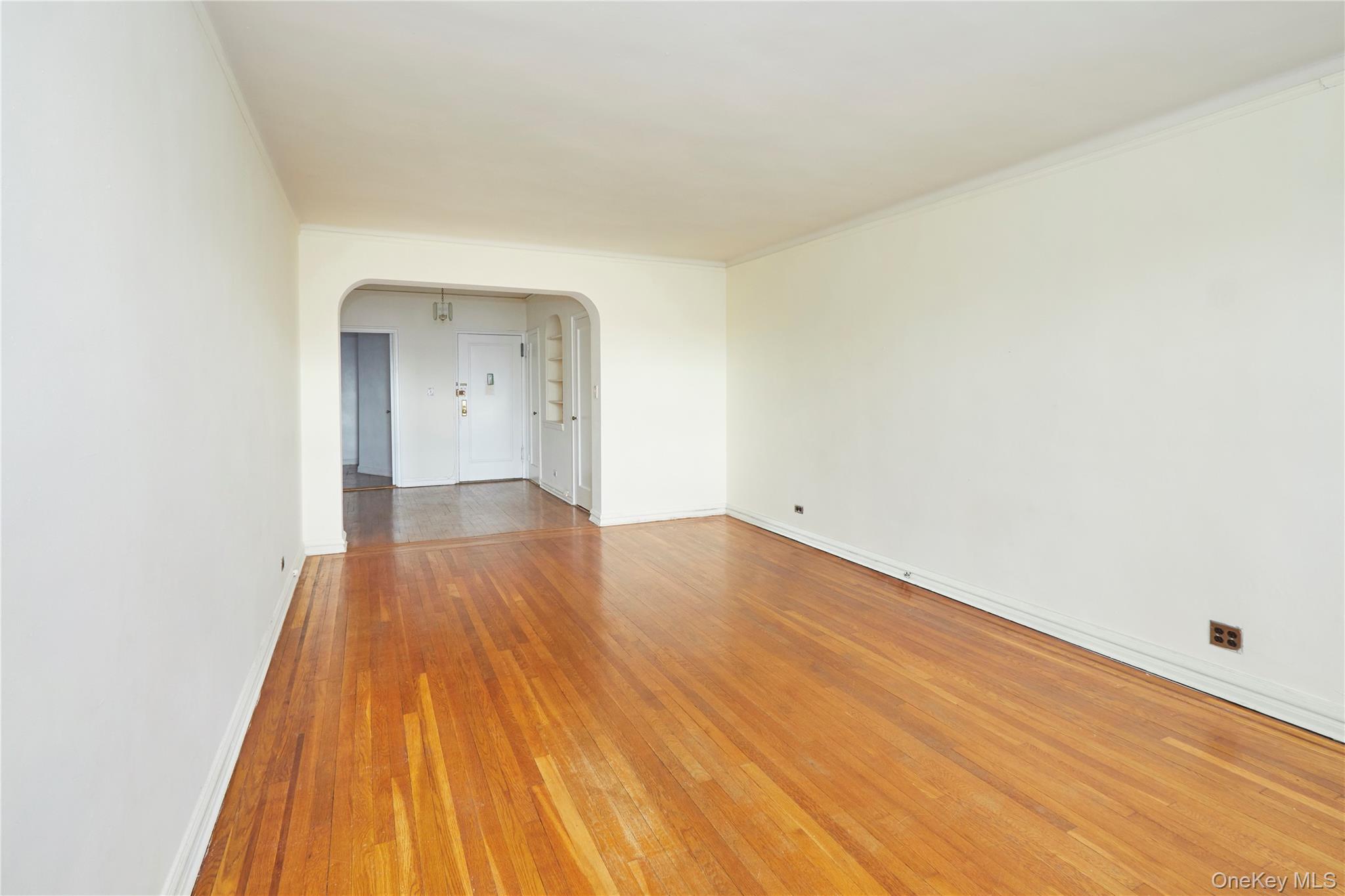 75-40 Austin Street, Unit 5 Queens, NY 11375 - Photo 5 of 12 a view of empty room with wooden floor