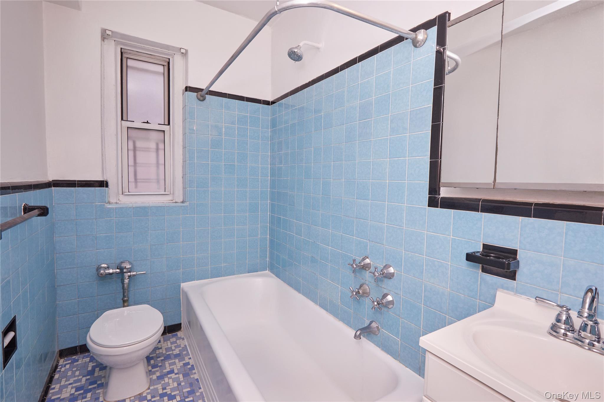 75-40 Austin Street, Unit 5 Queens, NY 11375 - Photo 7 of 12 a bathroom with a sink toilet and shower