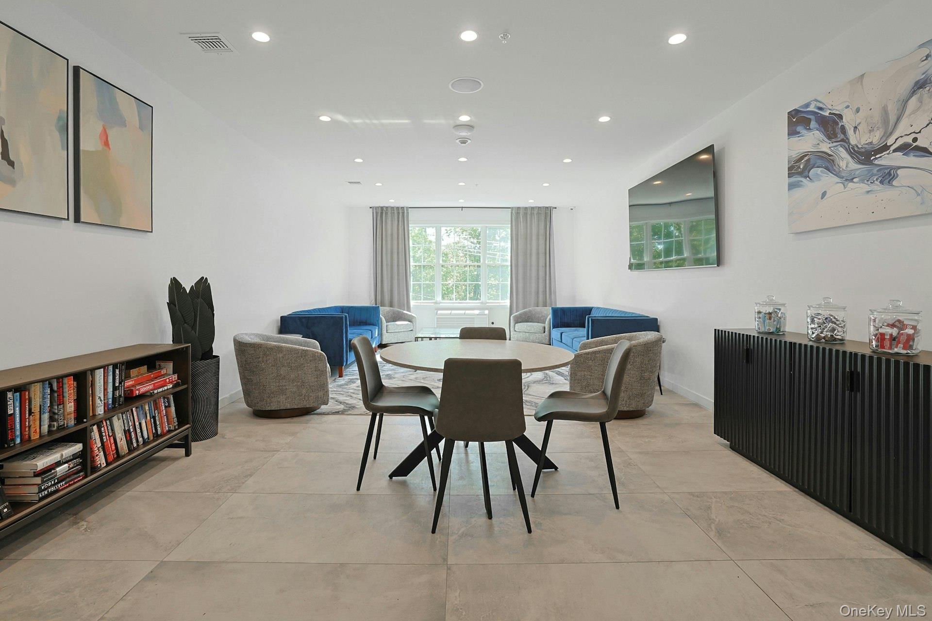 962 Rte 9W, Unit 106 Congers, NY 10920 - Photo 16 of 48 a view of a dining room with furniture window and wooden floor