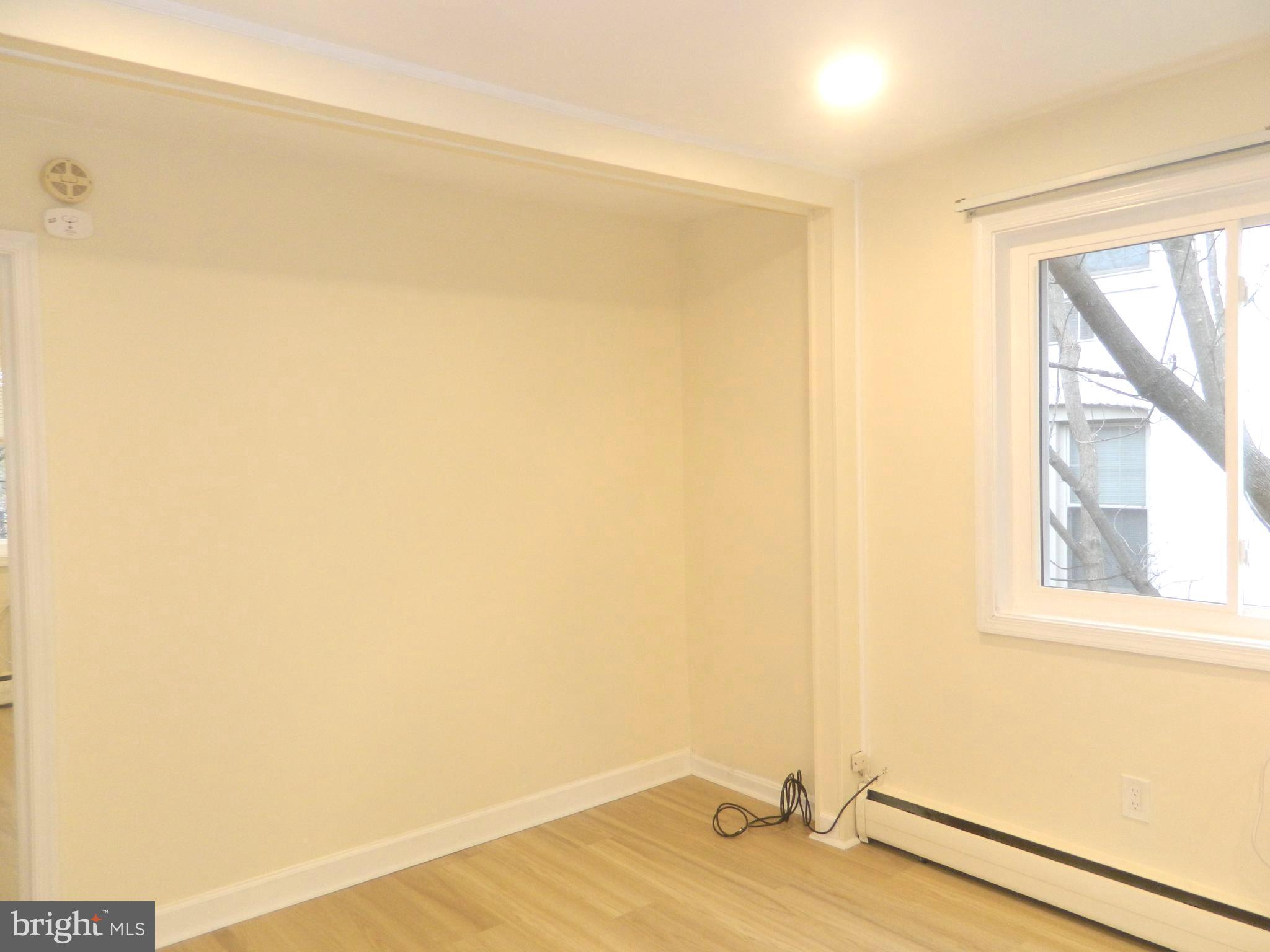 513 12th Street Northeast, Unit 9 Washington, DC 20002 - Photo 14 of 29 a view of a room with a wooden floor and a window