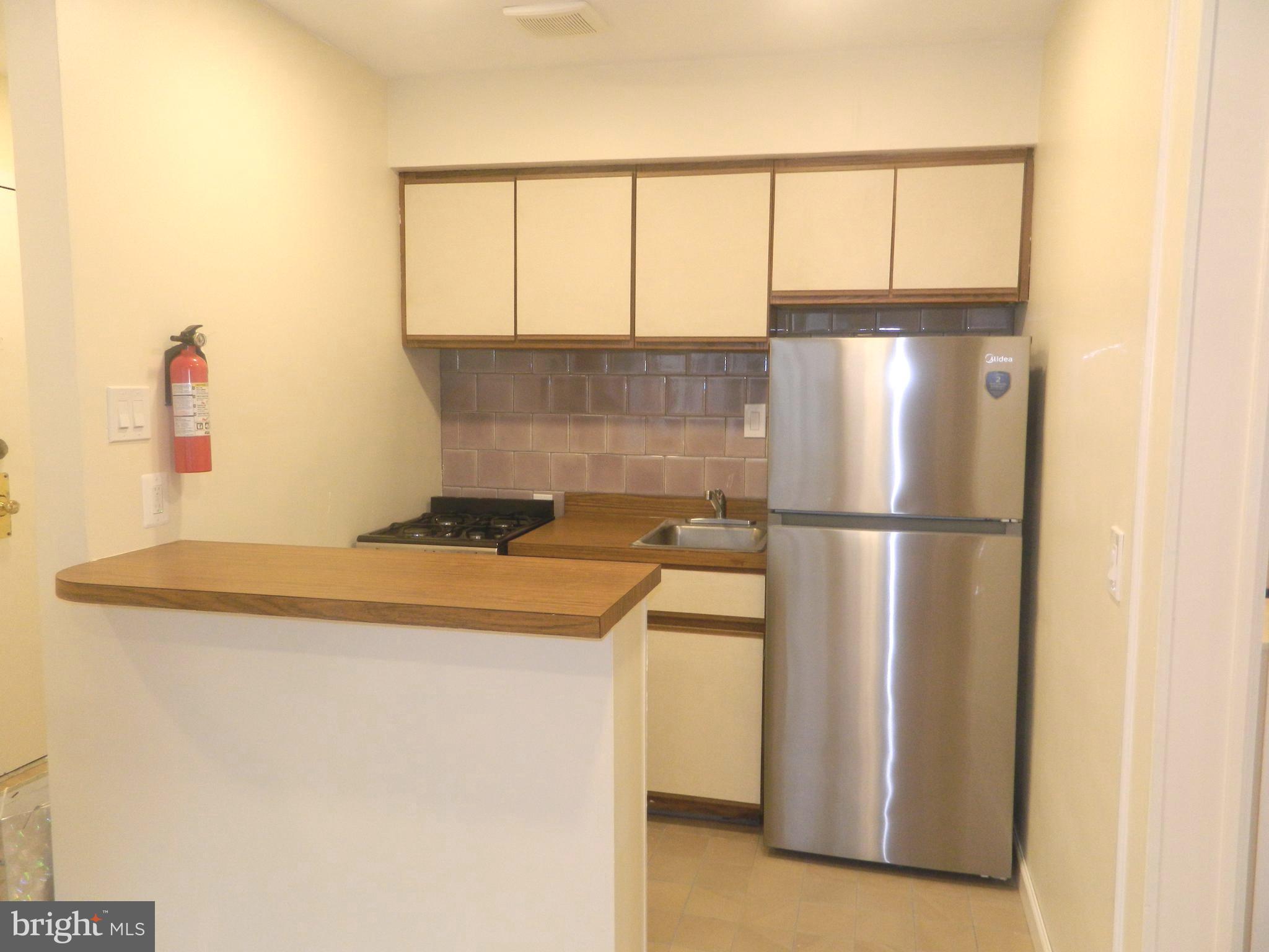 513 12th Street Northeast, Unit 9 Washington, DC 20002 - Photo 2 of 29 a utility room with dryer and washer
