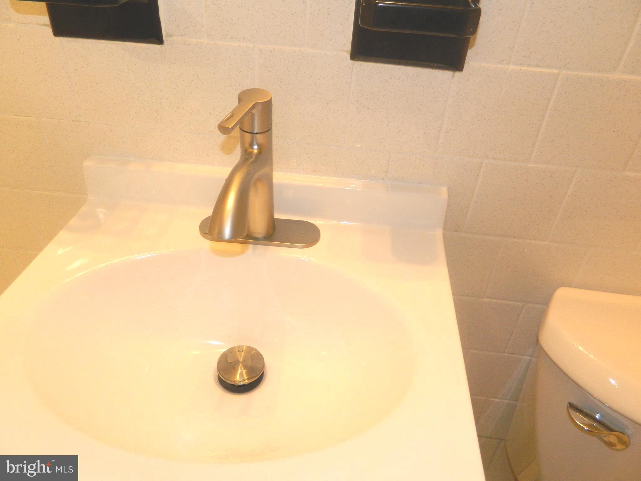 513 12th Street Northeast, Unit 9 Washington, DC 20002 - Photo 26 of 29 a bathroom with a sink
