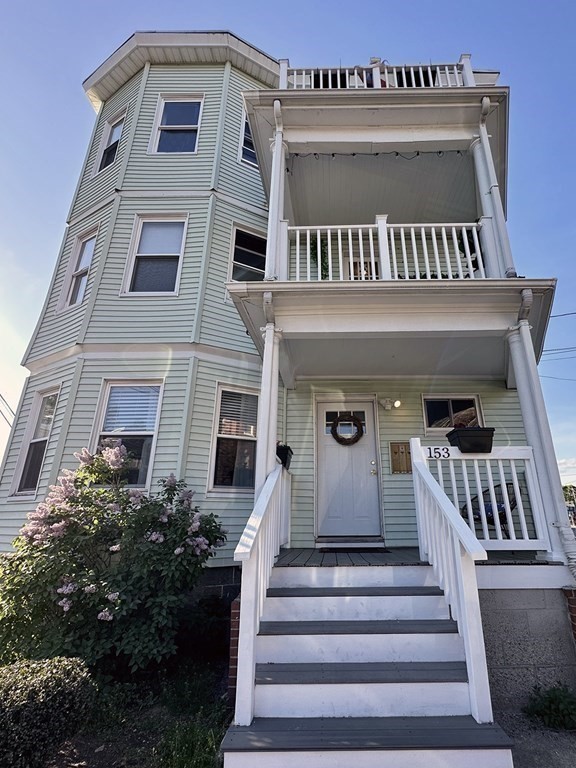 153 Rowe Street, Unit 1 Boston, MA 02131 - Photo 11 of 11 a view of a building with entryway and windows