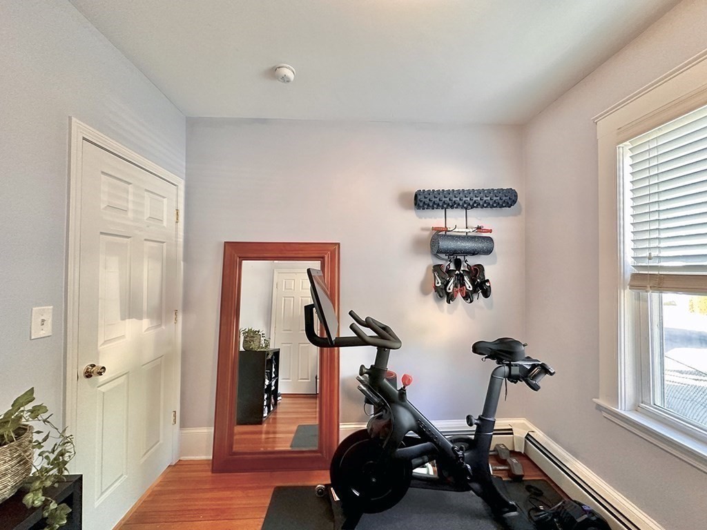 153 Rowe Street, Unit 1 Boston, MA 02131 - Photo 8 of 11 a view of a room with gym equipment