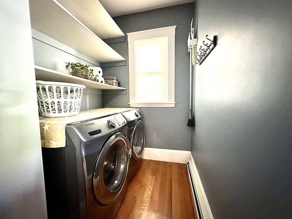 153 Rowe Street, Unit 1 Boston, MA 02131 - Photo 9 of 11 a utility room with dryer and washer