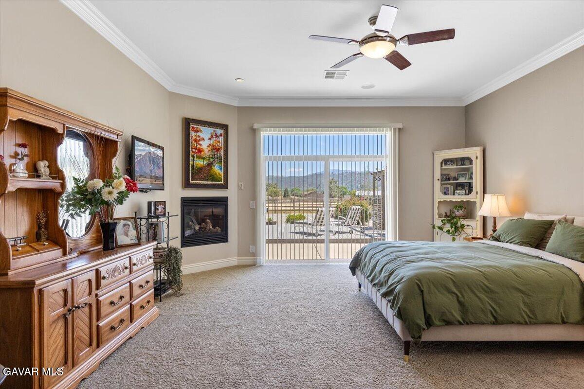 23840 Martingale Way Tehachapi, CA 93561 - Photo 25 of 63 a spacious bedroom with a bed window and a flat tv screen