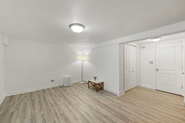 a room with furniture and wooden floor