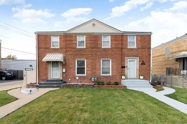 an aerial view of a house with a ocean view