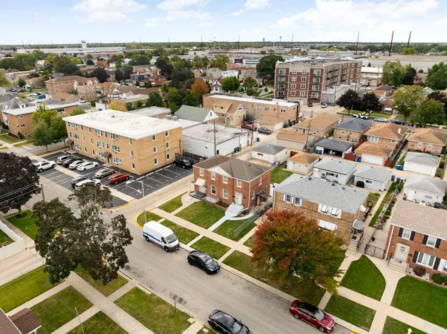 an aerial view of a house with a city view