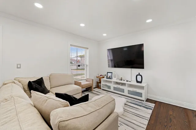 a living room with furniture a couch and a window
