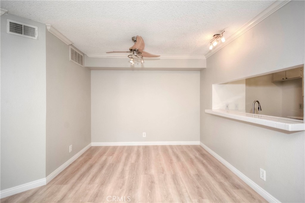 10655 Lemon Avenue, Unit 1001 Rancho Cucamonga, CA 91737 - Photo 11 of 22 a view of a room with a sink and cabinets
