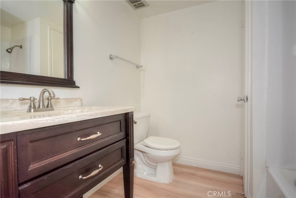 10655 Lemon Avenue, Unit 1001 Rancho Cucamonga, CA 91737 - Photo 17 of 22 a bathroom with a sink toilet and vanity