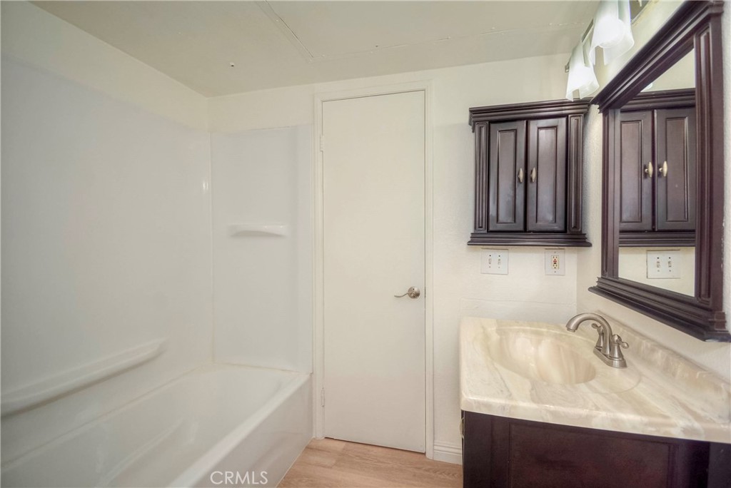 10655 Lemon Avenue, Unit 1001 Rancho Cucamonga, CA 91737 - Photo 18 of 22 a bathroom with a sink and a bathtub