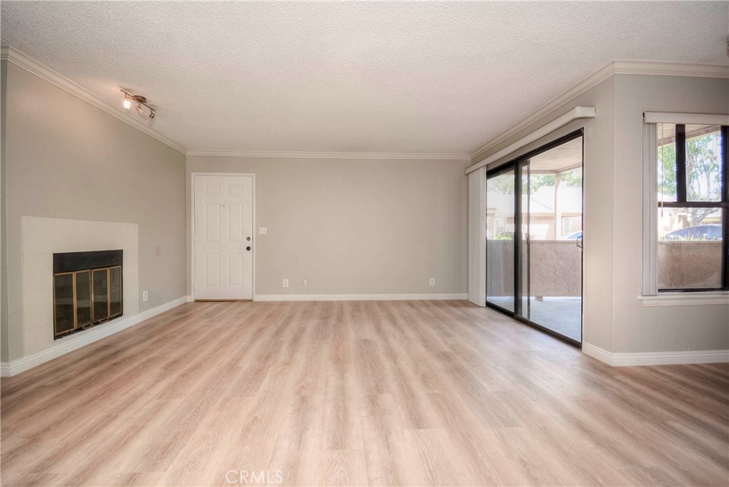 10655 Lemon Avenue, Unit 1001 Rancho Cucamonga, CA 91737 - Photo 10 of 22 wooden floor in an empty room with a window