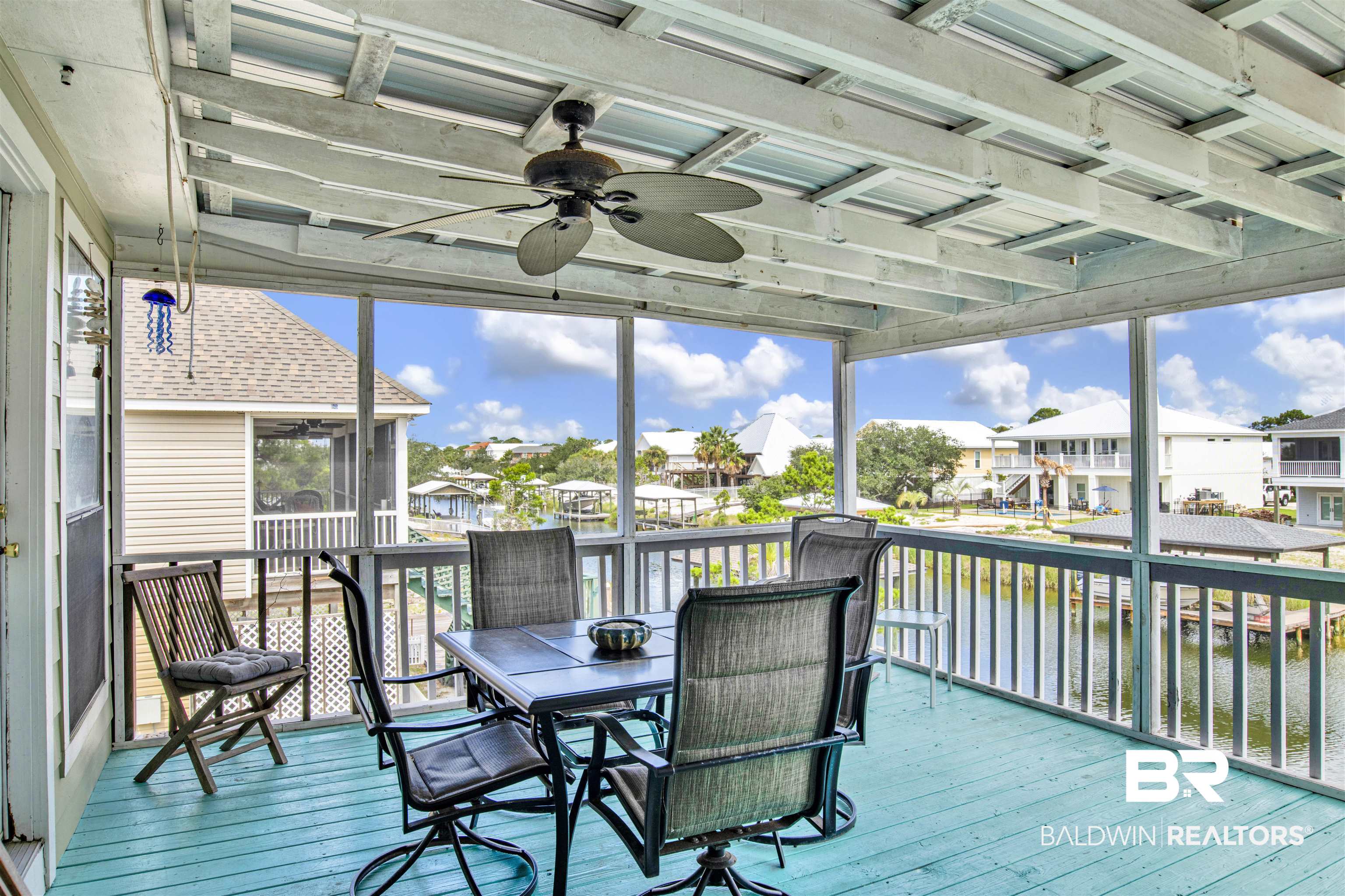 33093 River Road Orange Beach, AL 36561 - Photo 11 of 30 Sunroom / solarium featuring a healthy amount of sunlight and ceiling fan
