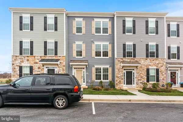 a car parked in front of a house
