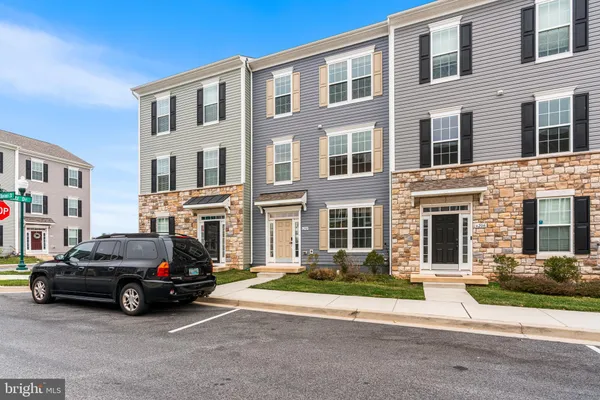 a view of a car parked in front of a building