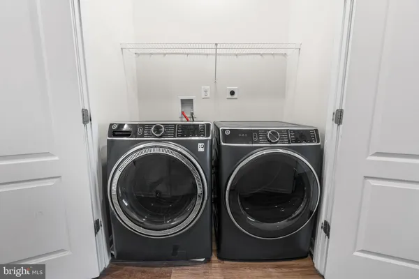 a view of bathroom with washer and dryer