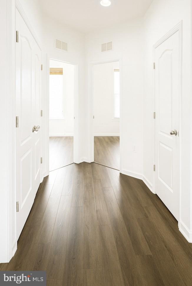 6202 Davinci Street Frederick, MD 21703 - Photo 30 of 36 a view of hallway with wooden floor