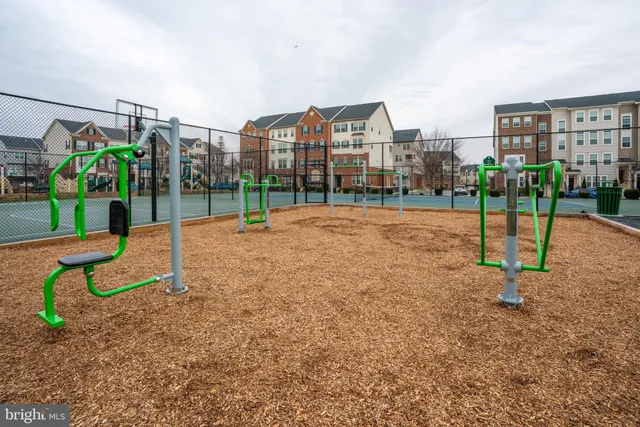 a view of a tennis ground with a street