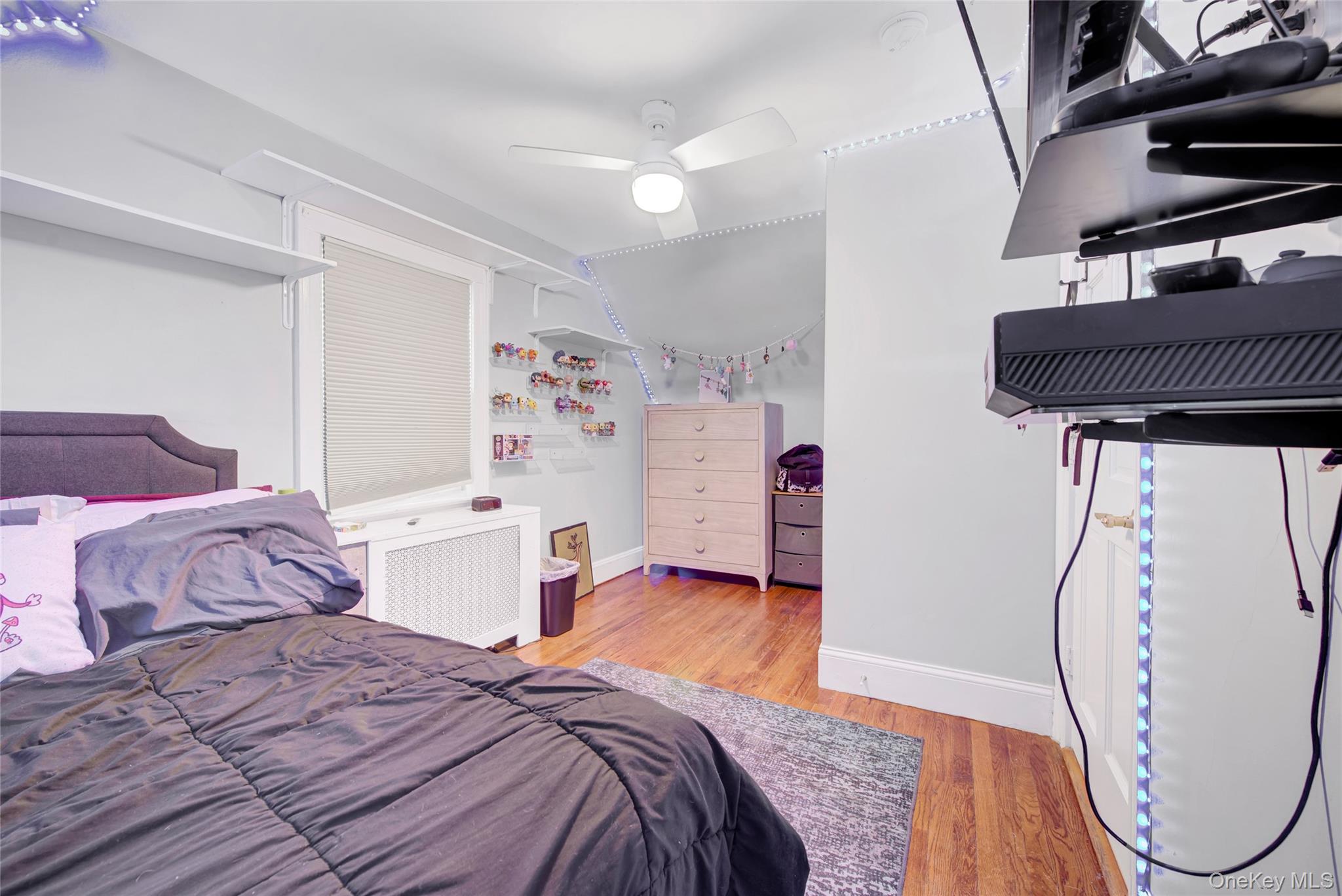 5 Argyle Road Merrick, NY 11566 - Photo 14 of 31 a bedroom with a bed and a table in it
