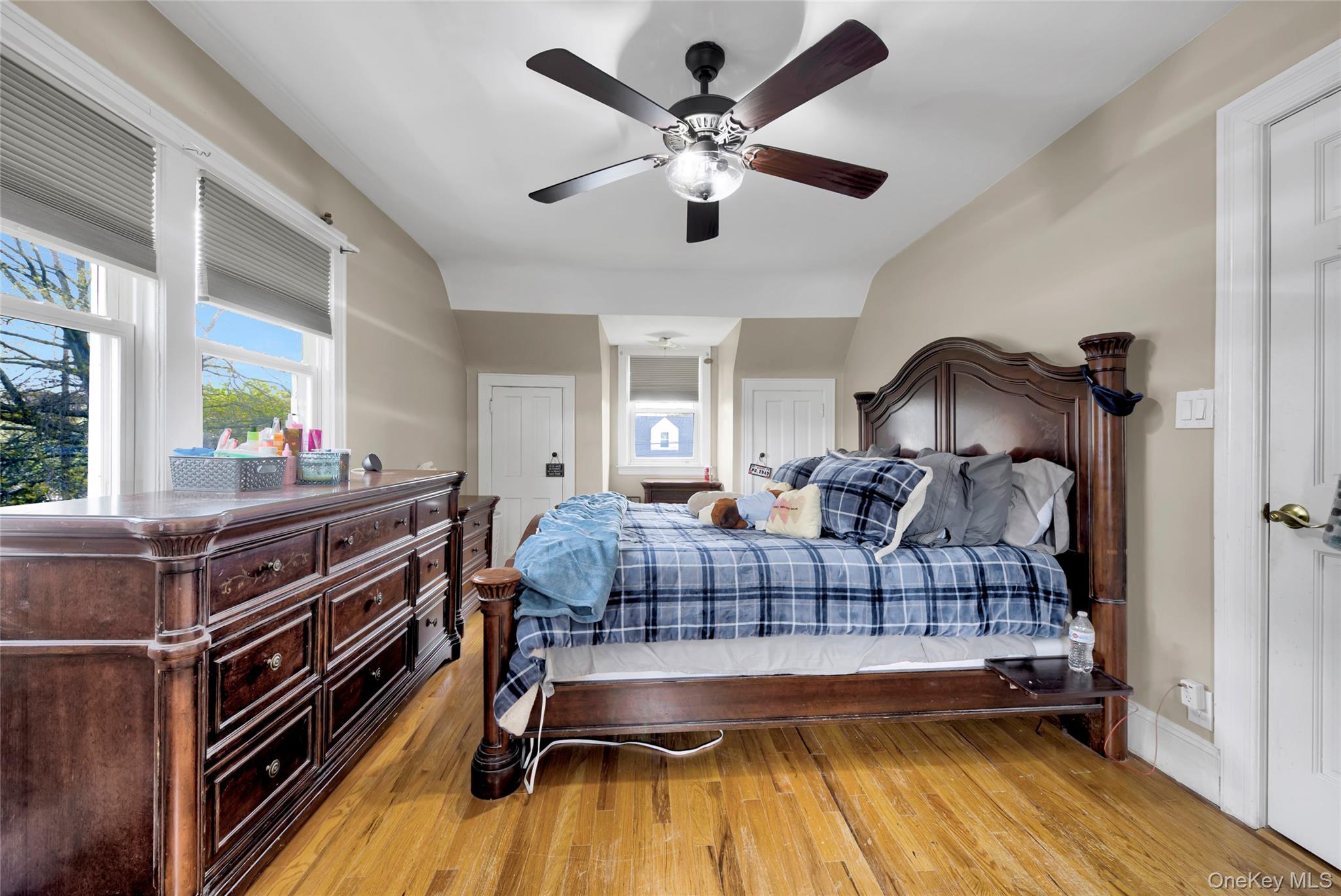 5 Argyle Road Merrick, NY 11566 - Photo 17 of 31 a bedroom with furniture and a wooden floor