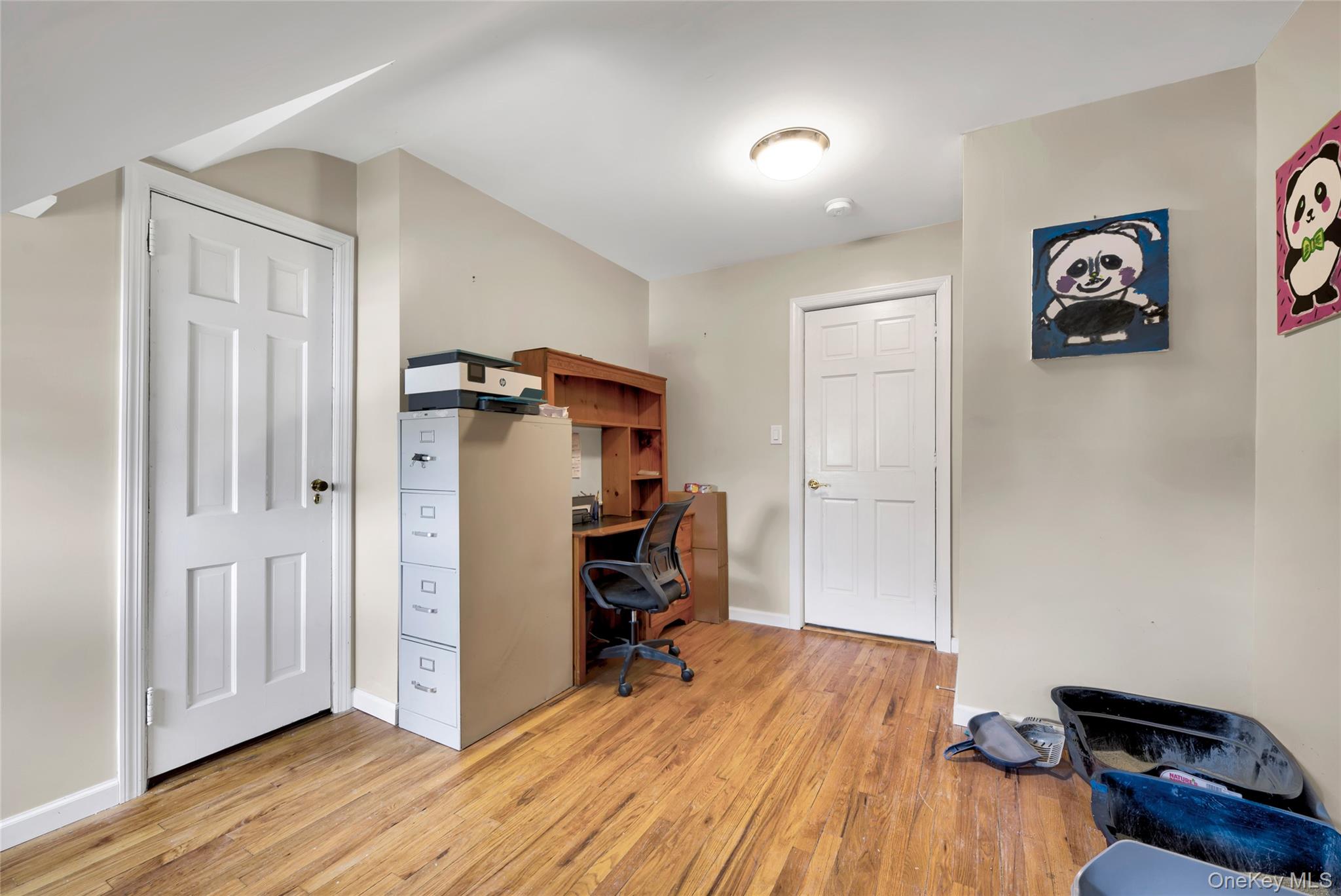 5 Argyle Road Merrick, NY 11566 - Photo 19 of 31 a view of a workspace with wooden floor and furniture