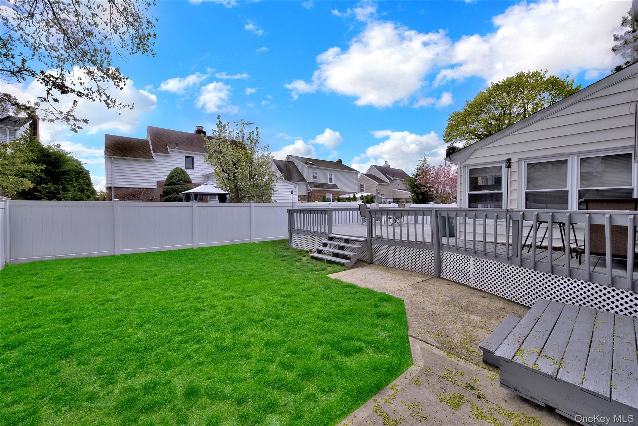 5 Argyle Road Merrick, NY 11566 - Photo 27 of 31 a view of a house with a yard and furniture
