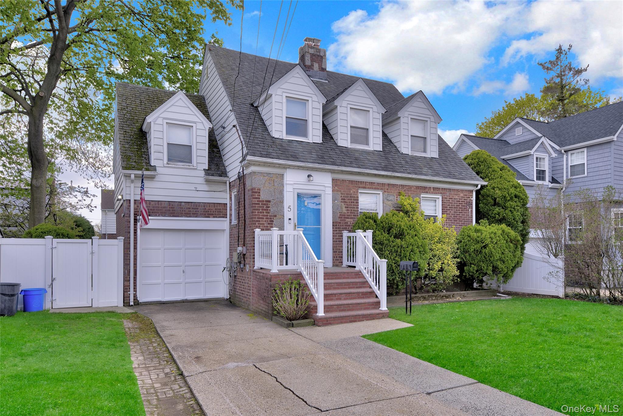 5 Argyle Road Merrick, NY 11566 - Photo 3 of 31 a front view of a house with a garden