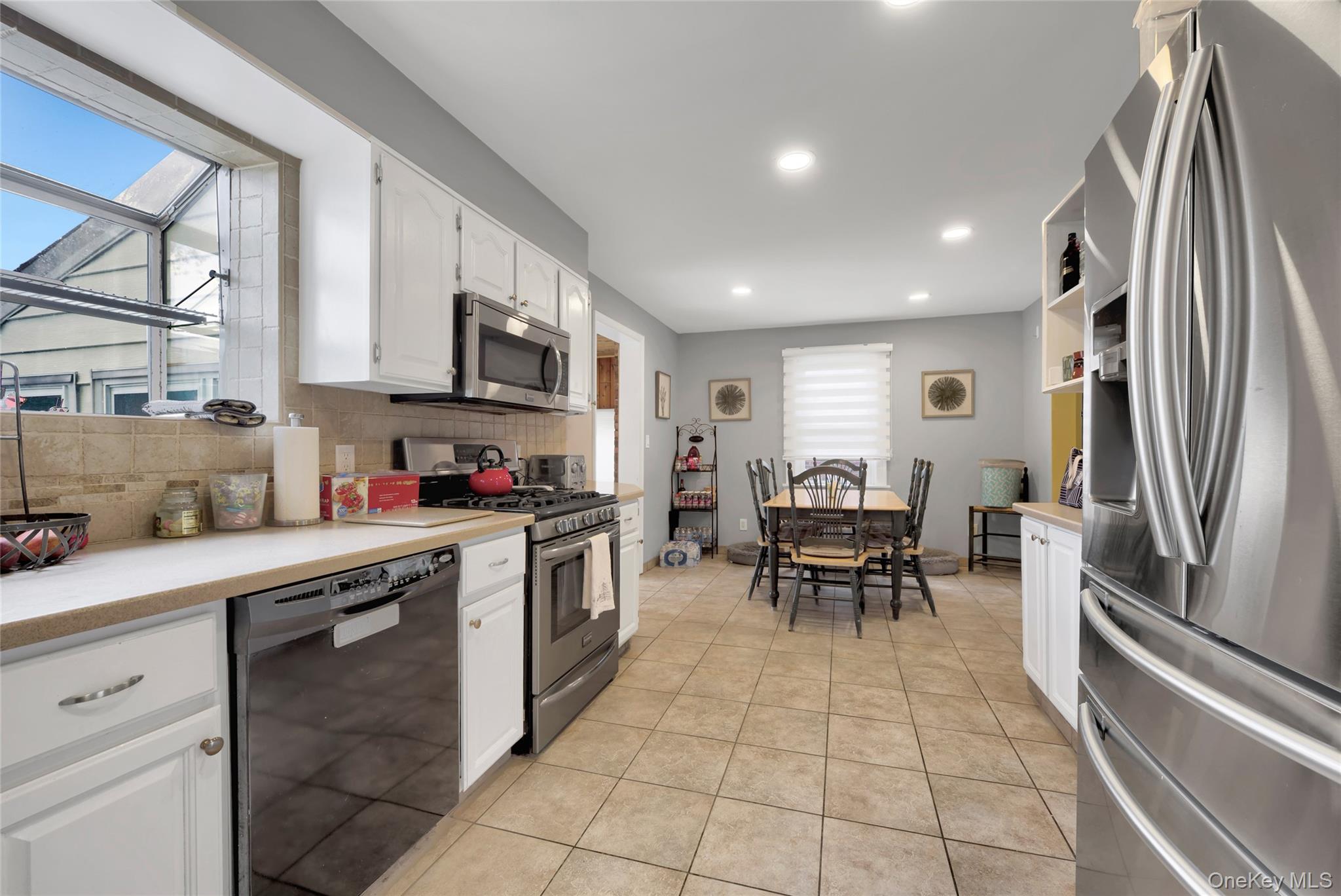 5 Argyle Road Merrick, NY 11566 - Photo 6 of 31 a kitchen with stainless steel appliances granite countertop a refrigerator and a sink