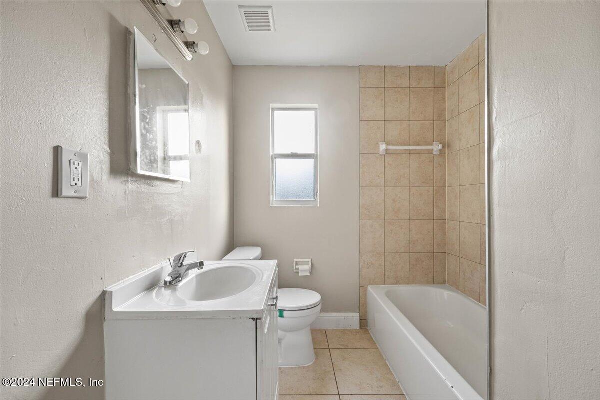 6584 Aires Road Jacksonville, FL 32244 - Photo 20 of 27 a bathroom with a sink toilet and shower