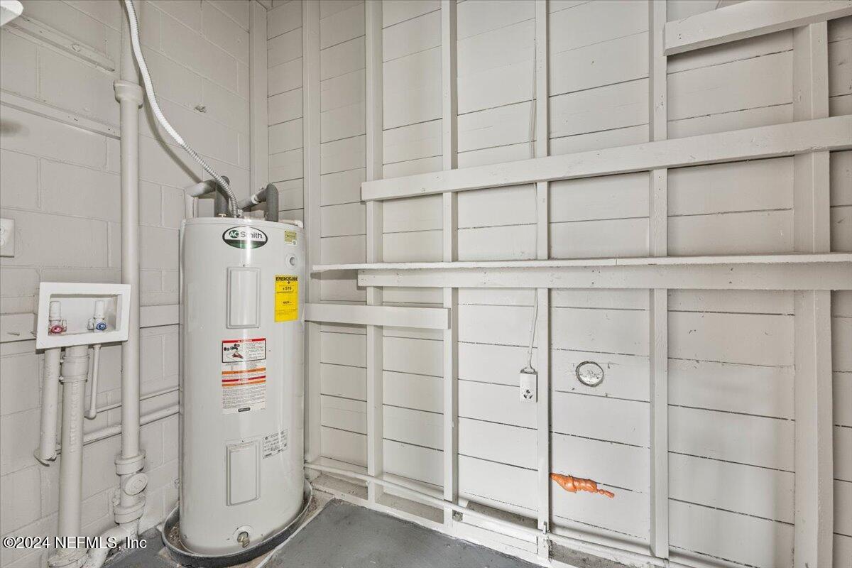 6584 Aires Road Jacksonville, FL 32244 - Photo 23 of 27 a utility room with dryer and washer