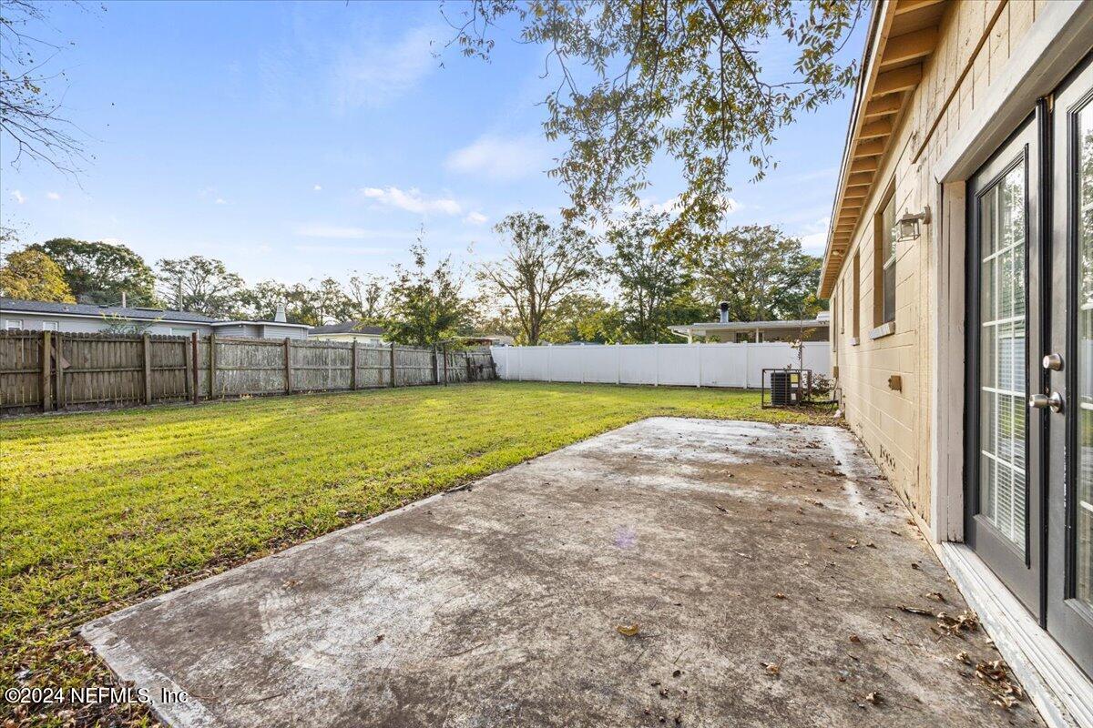 6584 Aires Road Jacksonville, FL 32244 - Photo 24 of 27 a view of a yard with an outdoor seating