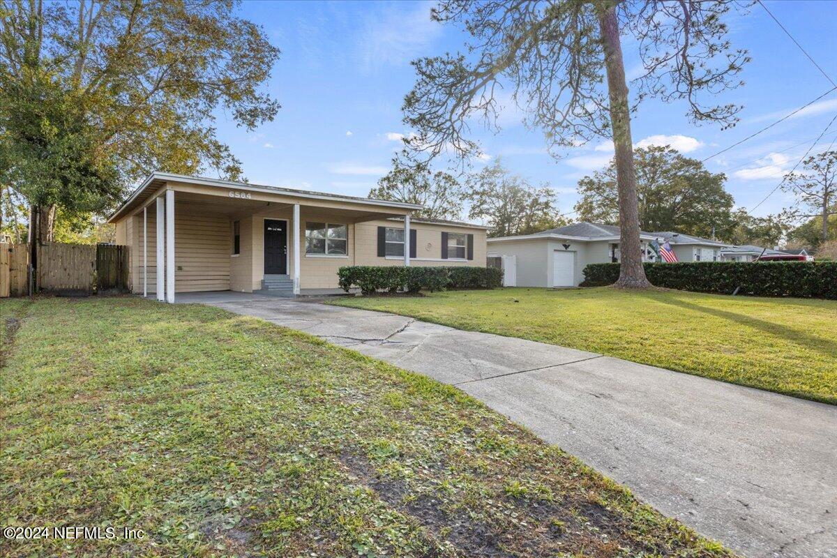 6584 Aires Road Jacksonville, FL 32244 - Photo 3 of 27 a view of a house with a yard