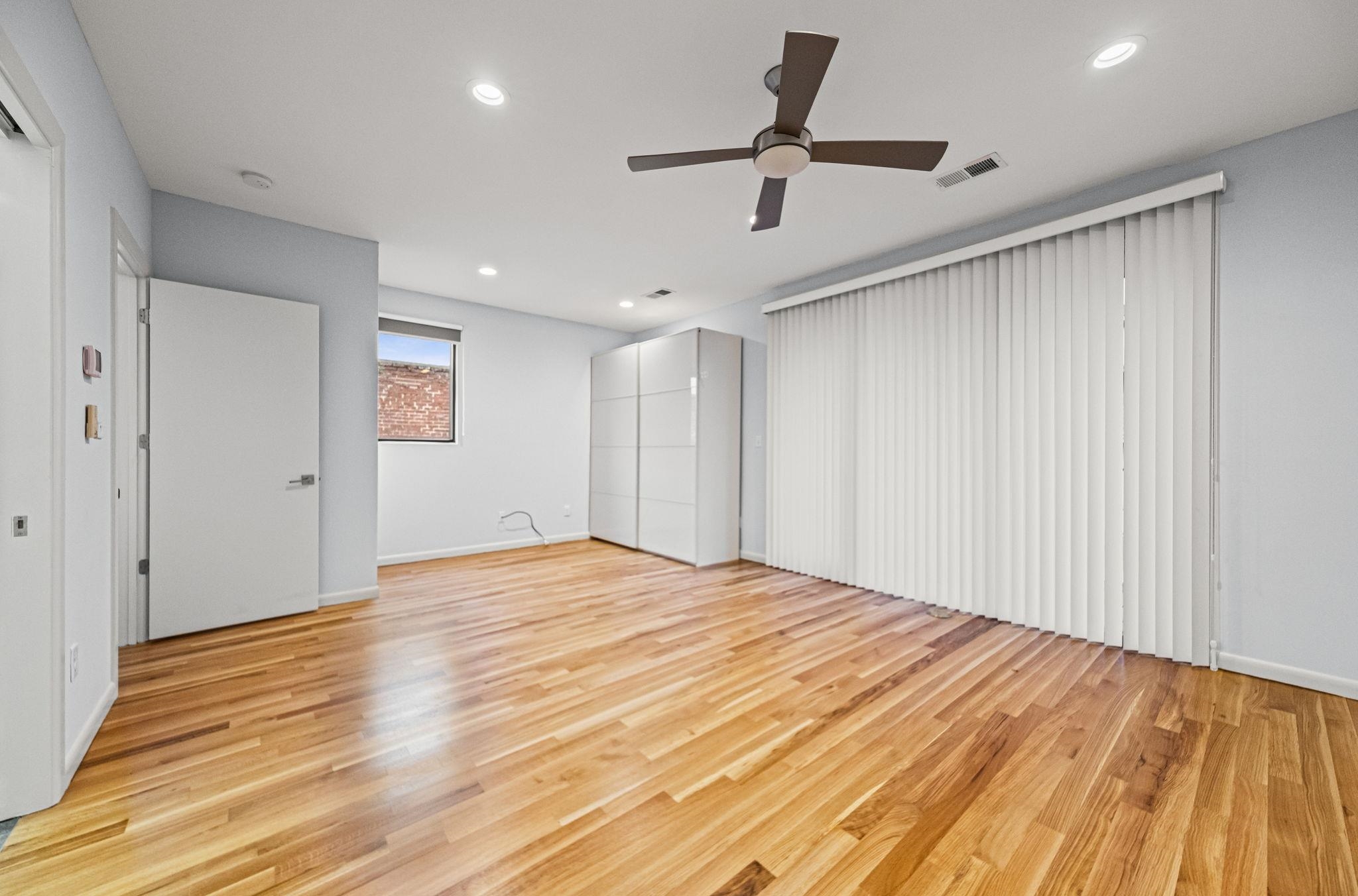 448 Tennessee Street Memphis, TN 38103 - Photo 24 of 39 Spacious room featuring wood-finish flooring, a contemporary ceiling fan, and recessed lighting