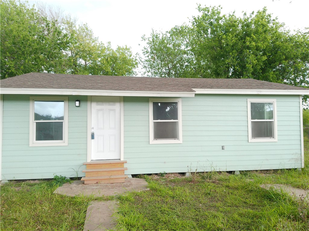 306 Allison Drive Gregory, TX 78359 - Photo 1 of 15 a front view of a house with a yard