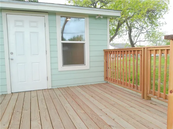 a view of outdoor space with deck and furniture