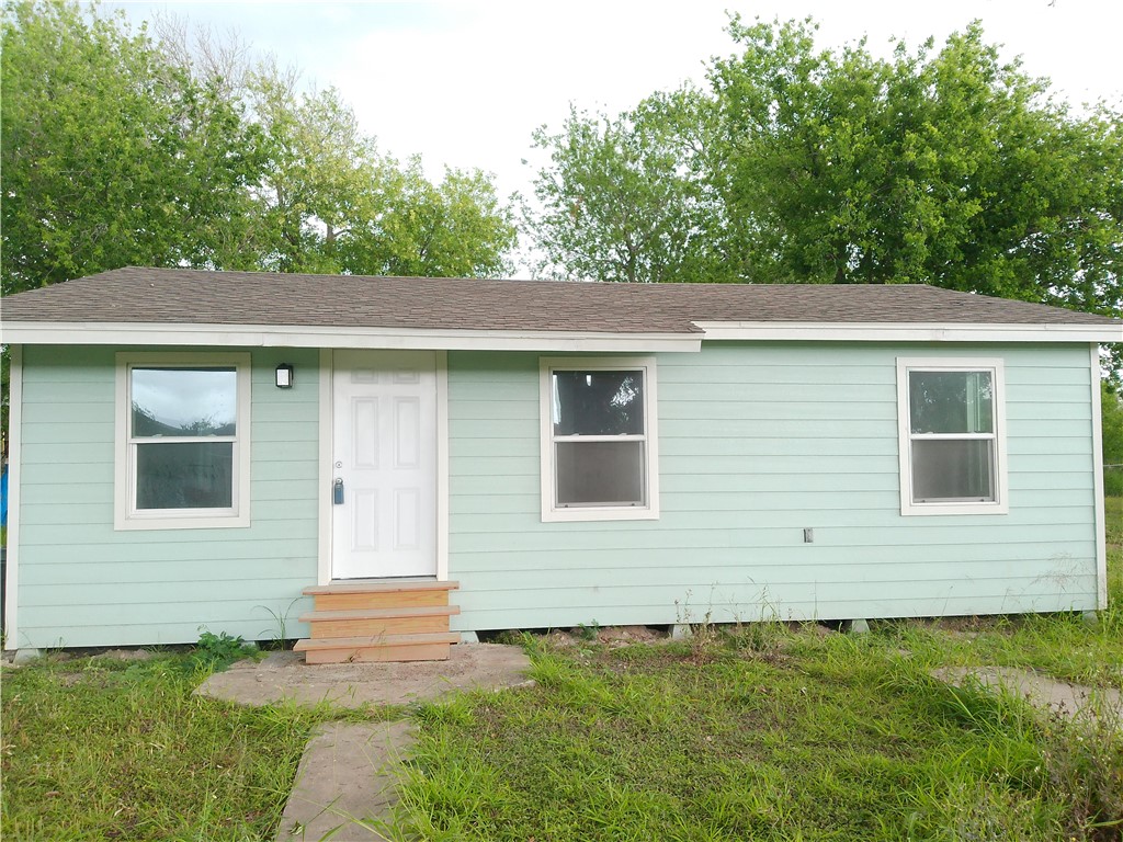 306 Allison Drive Gregory, TX 78359 - Photo 2 of 15 a front view of a house with a yard