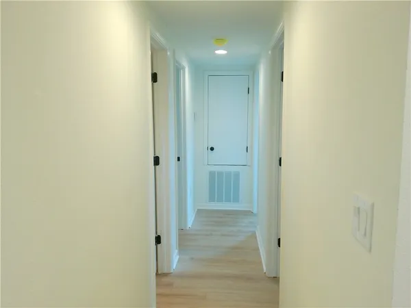 a view of a bathroom from the hallway