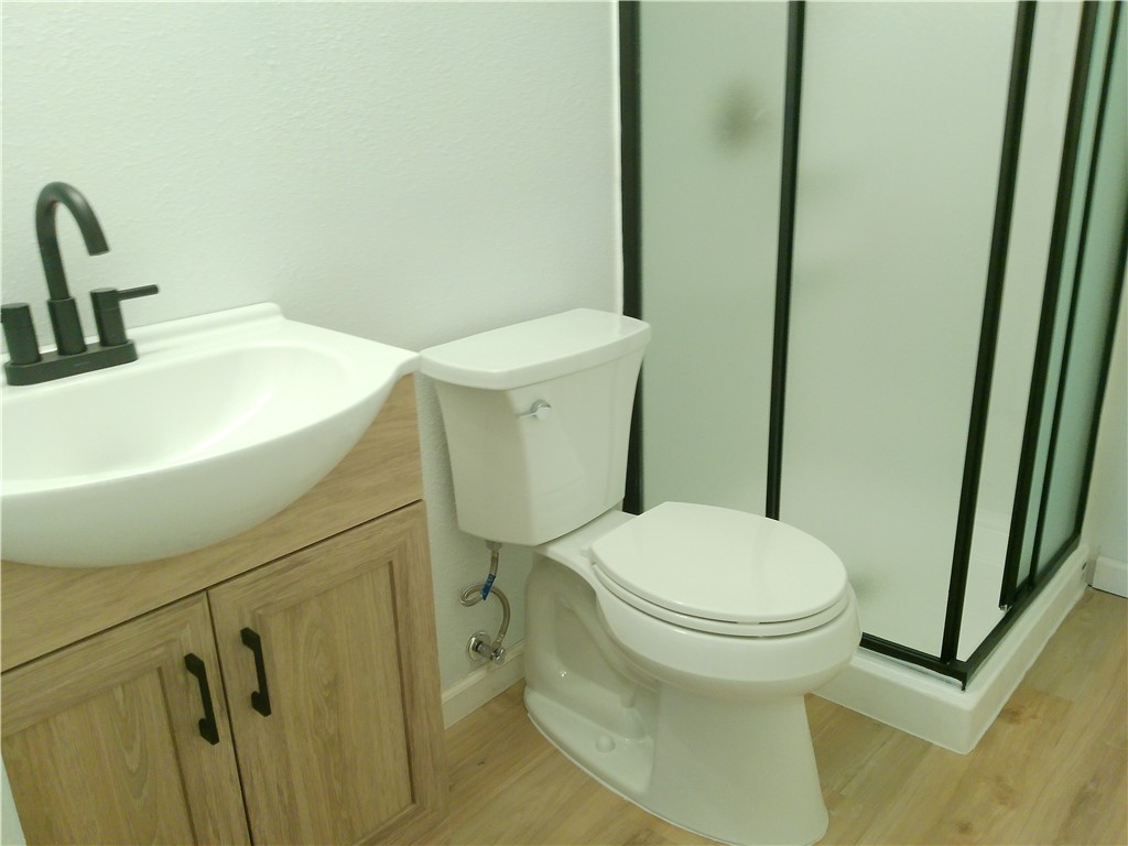 306 Allison Drive Gregory, TX 78359 - Photo 7 of 15 a white toilet sitting next to a sink