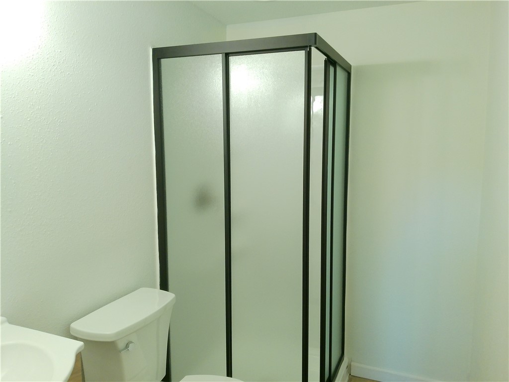306 Allison Drive Gregory, TX 78359 - Photo 8 of 15 a bathroom with a granite countertop toilet and a sink