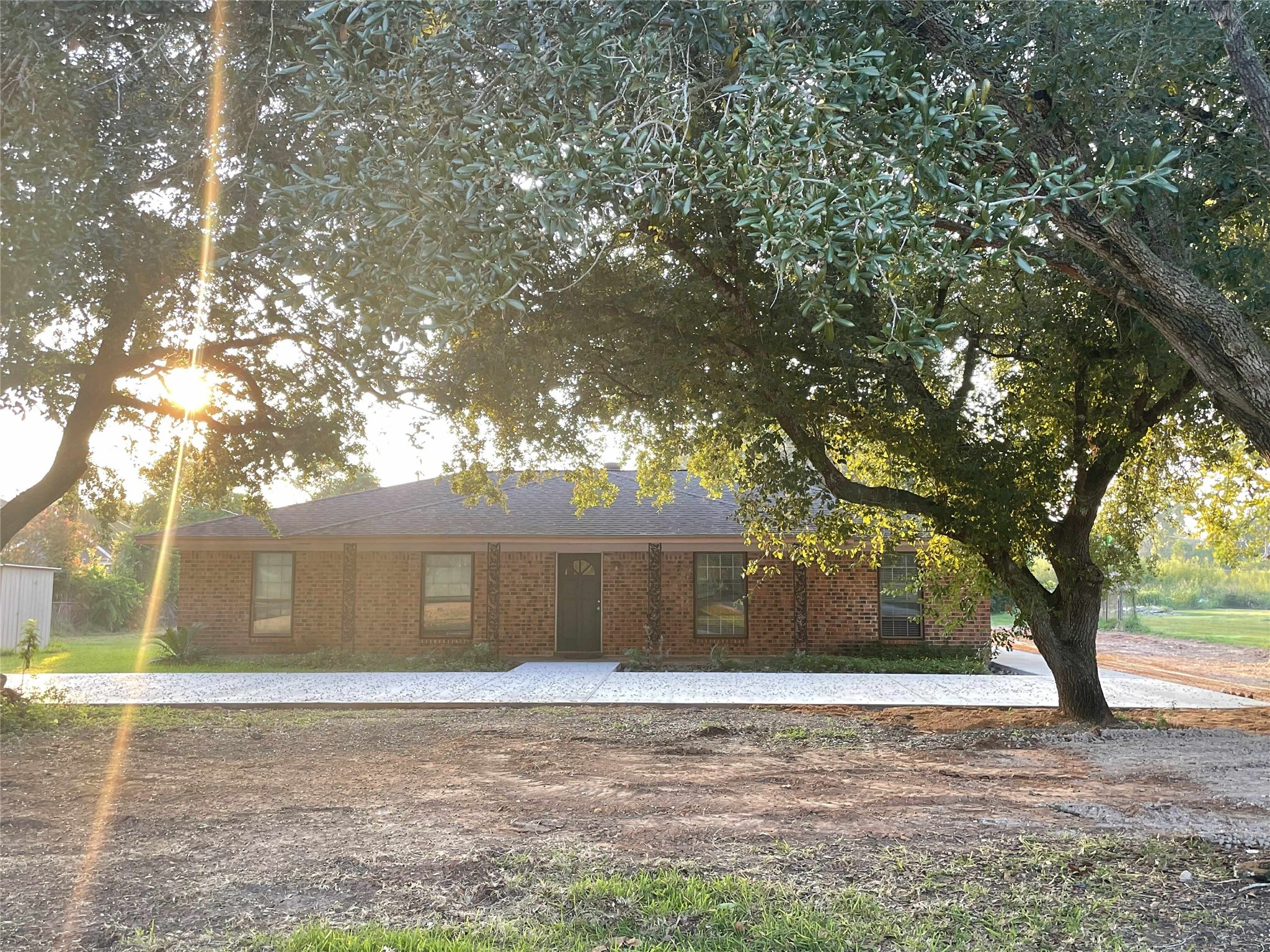 a view of a house with a yard and garage