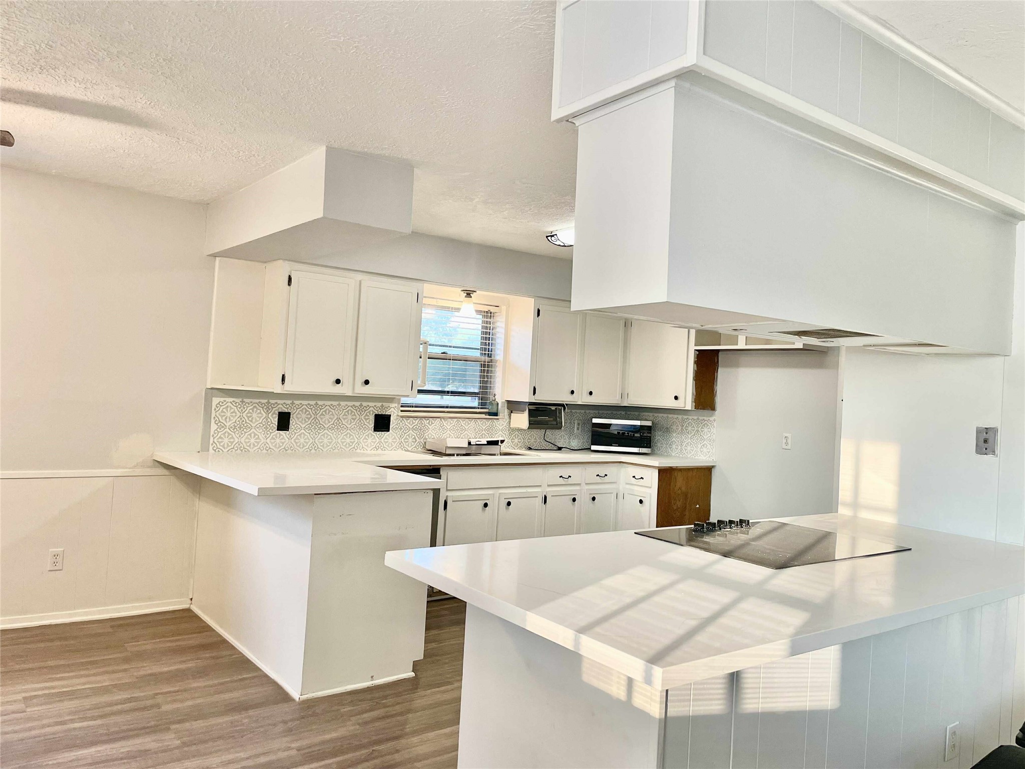 811 Tori Road Richmond, TX 77469 - Photo 5 of 14 a kitchen with a sink a stove and cabinets