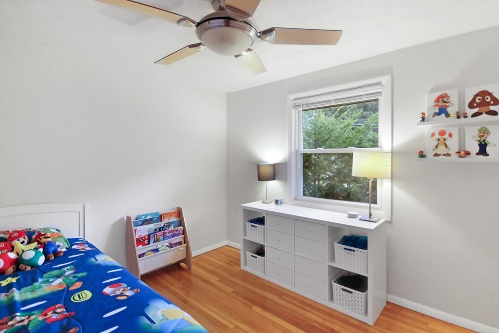 12 Prairie Road Chelmsford, MA 01824 - Photo 20 of 33 a room with furniture a baby crib and a window