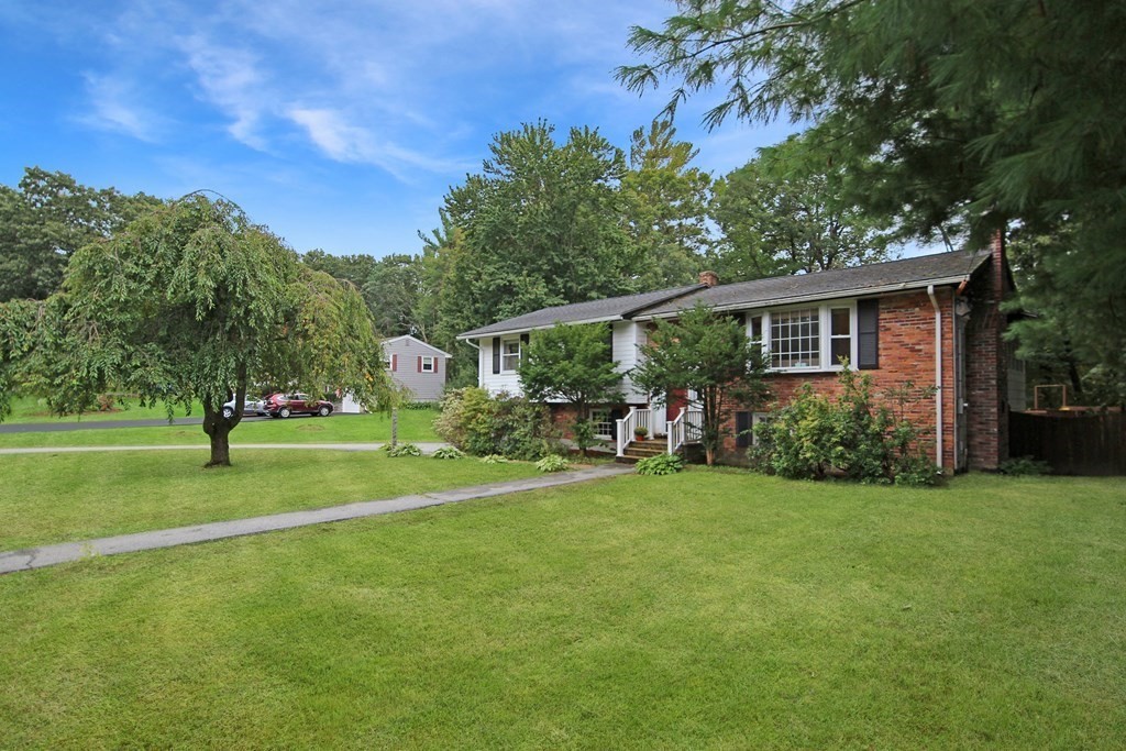 12 Prairie Road Chelmsford, MA 01824 - Photo 28 of 33 a view of a house with a backyard